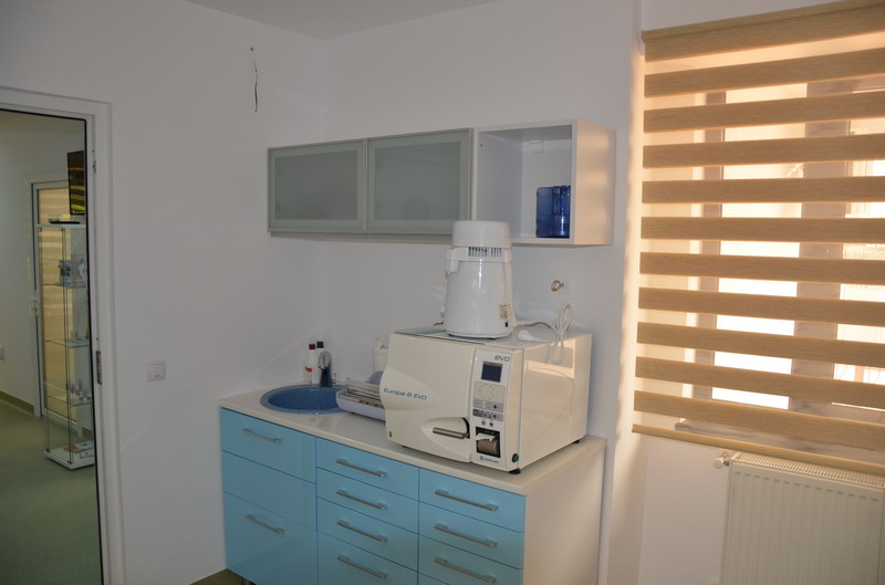 Dental office waiting area with comfortable chairs and bright lighting